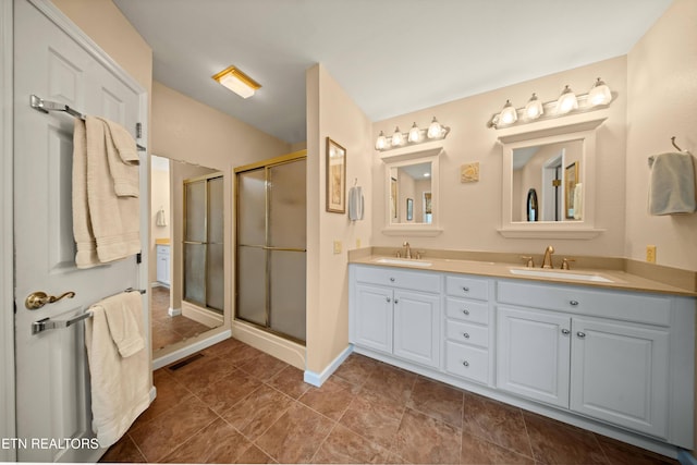 12 Wessex Ct, Crossville, TN 38558 - full bathroom featuring visible vents, a sink, double vanity, and a shower stall