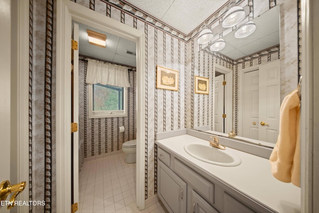 12 Wessex Ct, Crossville, TN 38558 - full bath featuring baseboards, wallpapered walls, toilet, vanity, and tile patterned flooring