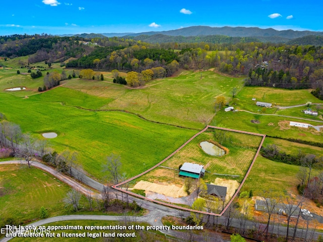 bird's eye view with a mountain view and a rural view