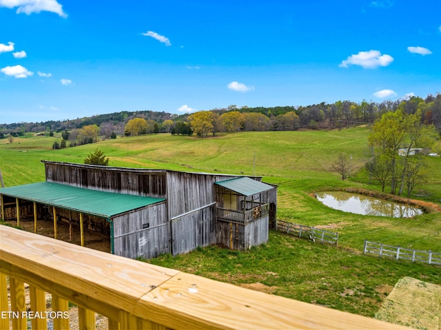 view of yard with an outdoor structure and a water view