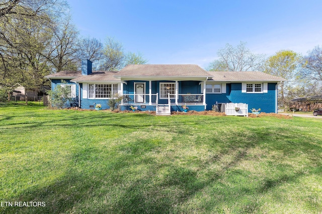 201 Farlow Dr, Knoxville, TN 37934 - view of front facade featuring a porch, a chimney, a front yard, and brick siding