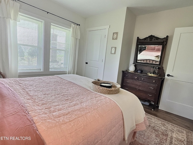 bedroom with wood finished floors