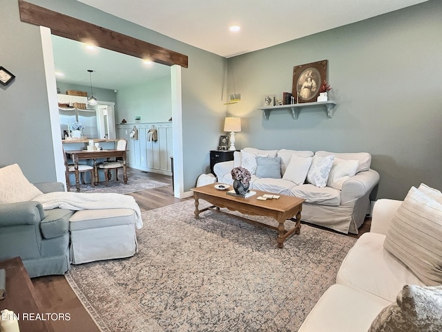 living area with wood finished floors and recessed lighting
