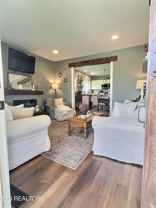 living room featuring wood finished floors and recessed lighting