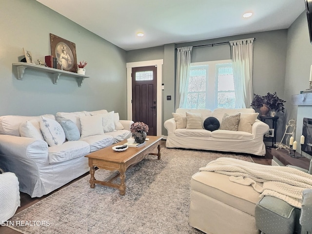 living room with wood finished floors and recessed lighting