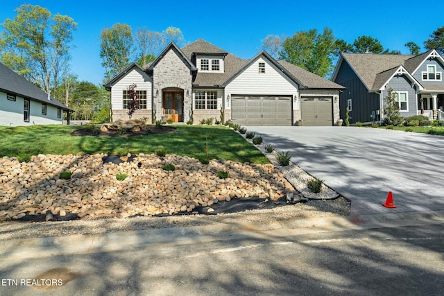 204 Atoka Pl, Loudon, TN 37774 - view of front of house with an attached garage, stone siding, and driveway