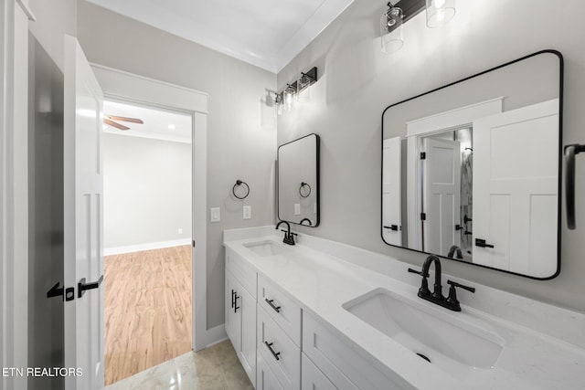 204 Atoka Pl, Loudon, TN 37774 - full bathroom with double vanity, baseboards, a sink, and ornamental molding