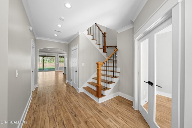 204 Atoka Pl, Loudon, TN 37774 - interior space with crown molding, arched walkways, and wood finished floors
