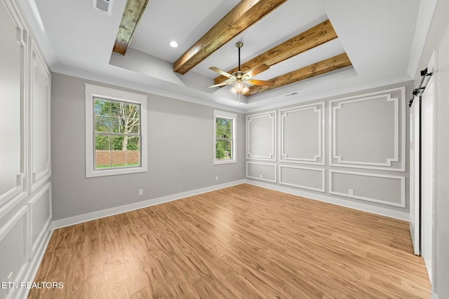 204 Atoka Pl, Loudon, TN 37774 - unfurnished bedroom with baseboards, light wood-style flooring, visible vents, beam ceiling, and a decorative wall