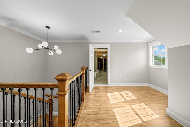 204 Atoka Pl, Loudon, TN 37774 - hall featuring visible vents, baseboards, light wood-type flooring, an upstairs landing, and crown molding