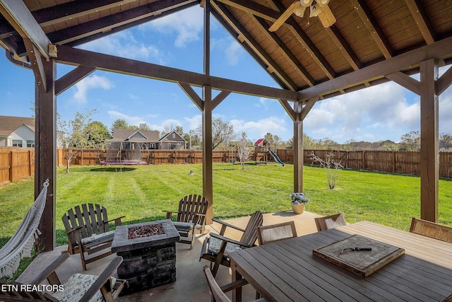 1798 Pearl Ave, Cookeville, TN 38506 - view of patio / terrace featuring a trampoline, an outdoor fire pit, a fenced backyard, outdoor dining space, and a playground