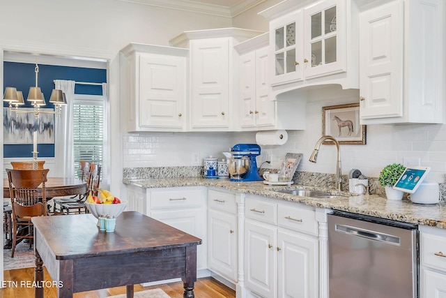 1798 Pearl Ave, Cookeville, TN 38506 - kitchen featuring white cabinetry, a sink, light wood-type flooring, an inviting chandelier, and stainless steel dishwasher
