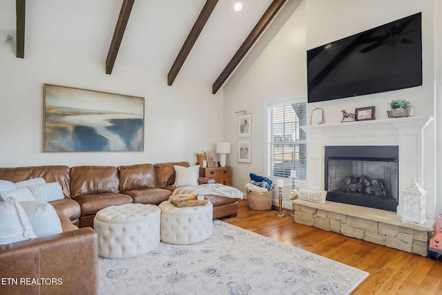 1798 Pearl Ave, Cookeville, TN 38506 - living room featuring lofted ceiling with beams, a stone fireplace, and wood finished floors