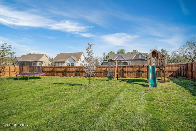 1798 Pearl Ave, Cookeville, TN 38506 - view of yard featuring a trampoline, a playground, a fenced backyard, and a residential view