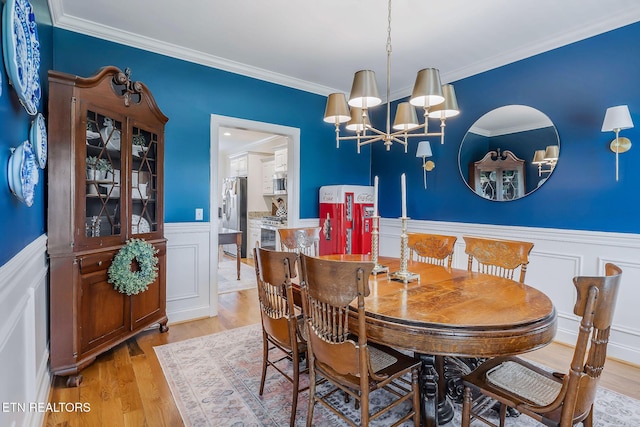 1798 Pearl Ave, Cookeville, TN 38506 - dining room with a wainscoted wall, light wood-style flooring, ornamental molding, and a chandelier