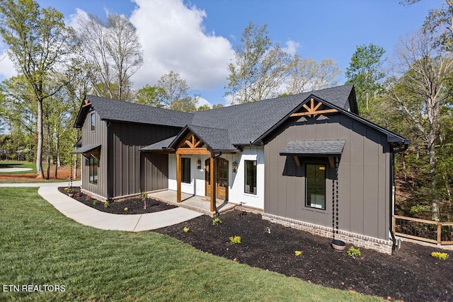 788 Blackberry Ridge Rd, Lenoir City, TN 37772 - modern inspired farmhouse featuring roof with shingles, board and batten siding, and a front lawn