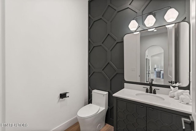 788 Blackberry Ridge Rd, Lenoir City, TN 37772 - bathroom with a decorative wall, vanity, baseboards, and toilet