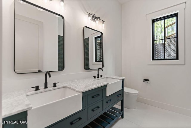 788 Blackberry Ridge Rd, Lenoir City, TN 37772 - full bathroom with a sink, toilet, double vanity, and baseboards
