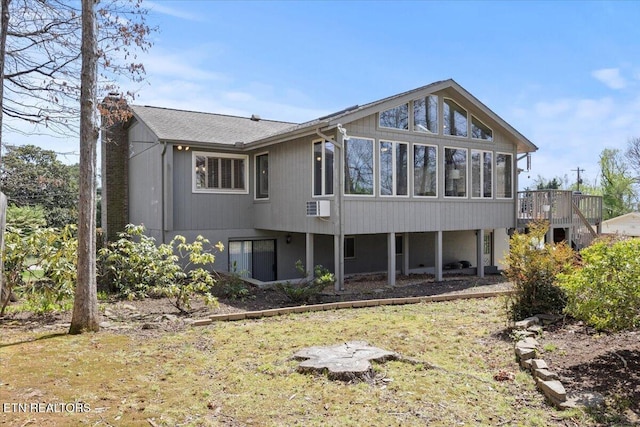 back of house with a sunroom