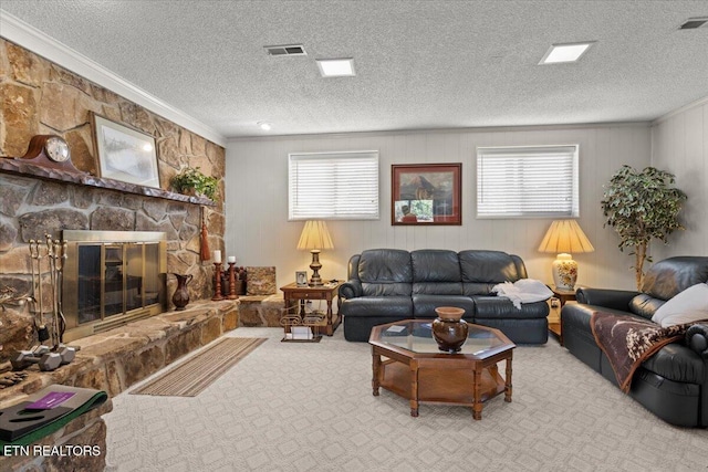 living area with ornamental molding, plenty of natural light, carpet, and visible vents