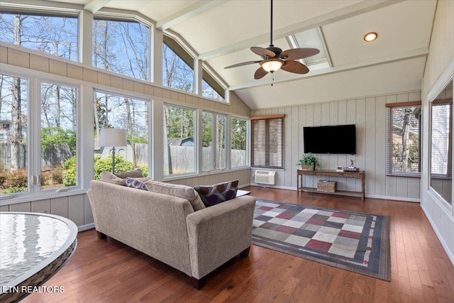 sunroom with plenty of natural light and hardwood / wood-style flooring