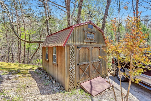 view of shed featuring a forest view