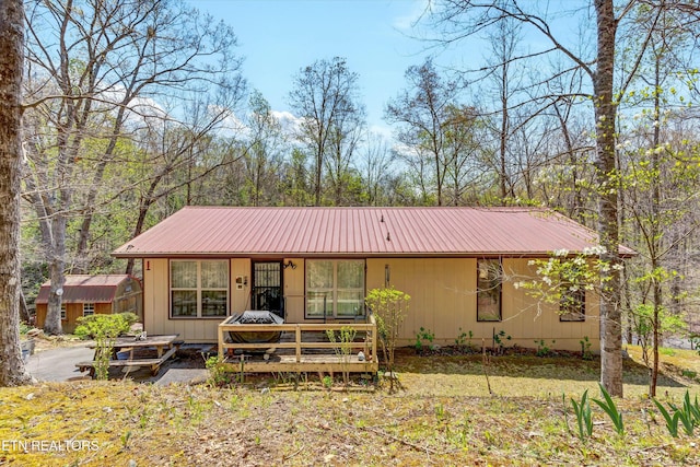 view of front facade with metal roof and covered porch