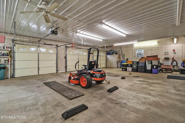garage featuring a garage door opener and metal wall