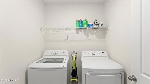 laundry area with laundry area and separate washer and dryer