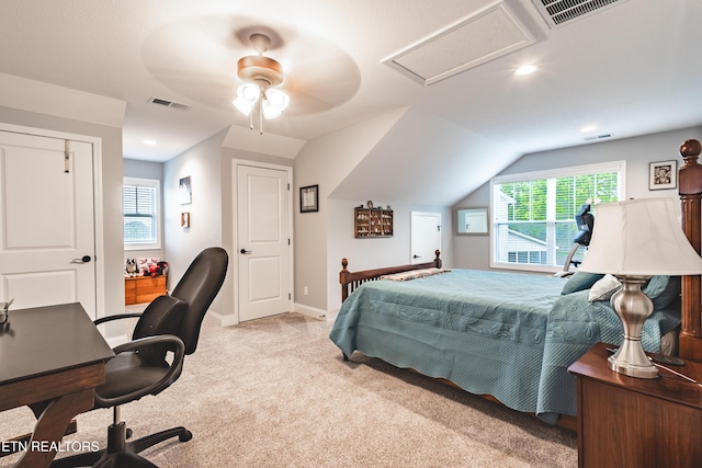 bedroom with attic access, visible vents, multiple windows, and carpet floors