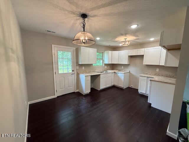 515 Hillcrest St, Clinton, TN 37716 - kitchen with dark wood finished floors, white cabinets, baseboards, decorative light fixtures, and recessed lighting