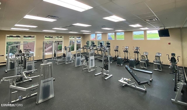 gym with visible vents and a drop ceiling