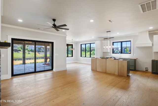 686 Ironwood Ln, Loudon, TN 37774 - kitchen with crown molding, a kitchen island, light wood-type flooring, open floor plan, and recessed lighting