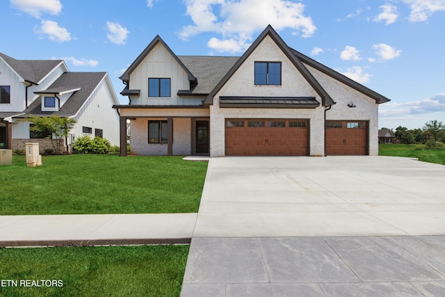 686 Ironwood Ln, Loudon, TN 37774 - modern farmhouse with a front yard, concrete driveway, a standing seam roof, board and batten siding, and brick siding