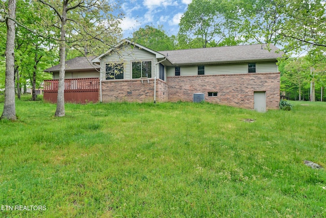 214 Snead Dr, Crossville, TN 38558 - view of front of home featuring brick siding, a deck, and central AC