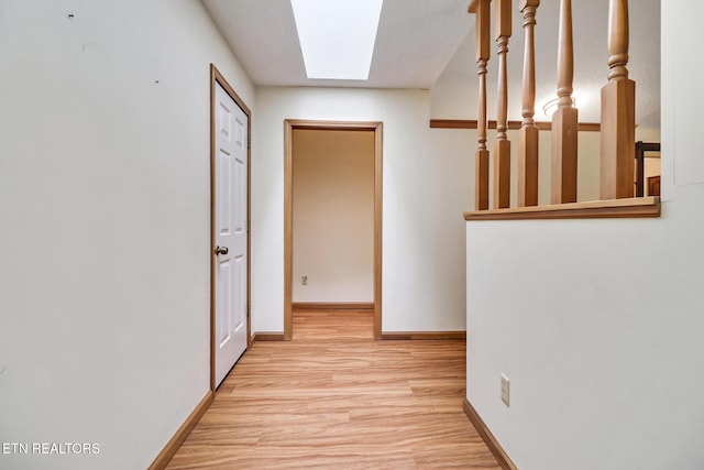 214 Snead Dr, Crossville, TN 38558 - hall with a skylight, wood finished floors, and baseboards