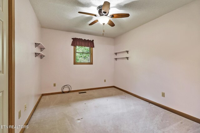 214 Snead Dr, Crossville, TN 38558 - carpeted empty room with baseboards, visible vents, ceiling fan, and a textured ceiling