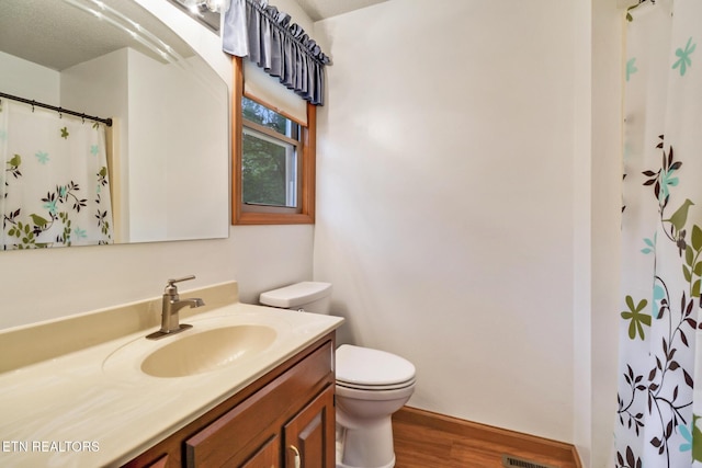 214 Snead Dr, Crossville, TN 38558 - full bathroom featuring toilet, wood finished floors, a shower with curtain, baseboards, and vanity