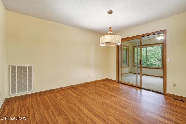 214 Snead Dr, Crossville, TN 38558 - empty room with baseboards, visible vents, and wood finished floors