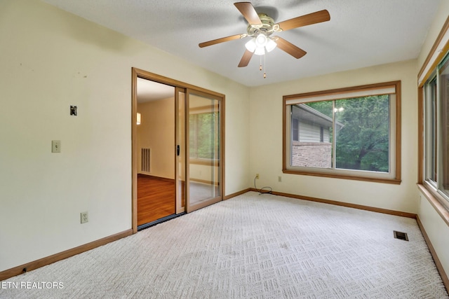 214 Snead Dr, Crossville, TN 38558 - carpeted spare room featuring visible vents, baseboards, and a ceiling fan