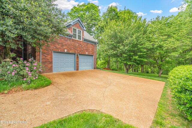 garage featuring driveway