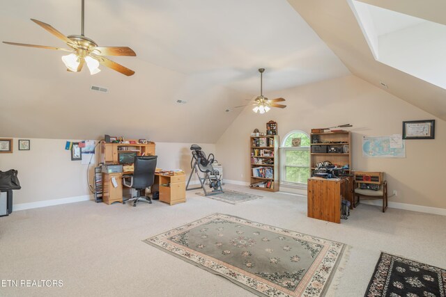 home office featuring visible vents, baseboards, ceiling fan, carpet flooring, and vaulted ceiling