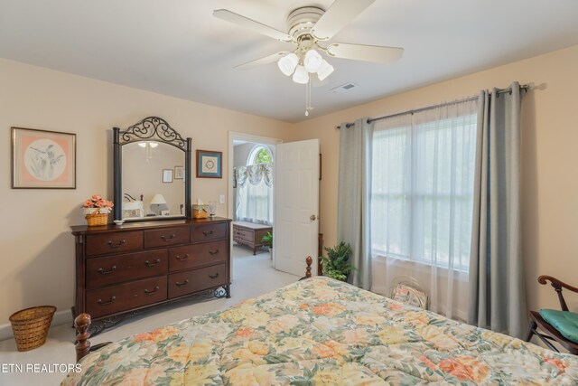 bedroom with ceiling fan and visible vents