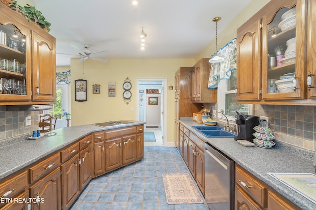 kitchen with a sink, a peninsula, dishwasher, a ceiling fan, and backsplash