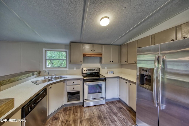 350 Kagley Dr, Lenoir City, TN 37771 - kitchen featuring dark wood-style floors, light countertops, under cabinet range hood, appliances with stainless steel finishes, and a sink