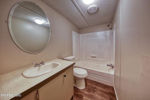 350 Kagley Dr, Lenoir City, TN 37771 - bathroom with  shower combination, a textured ceiling, toilet, visible vents, and wood finished floors