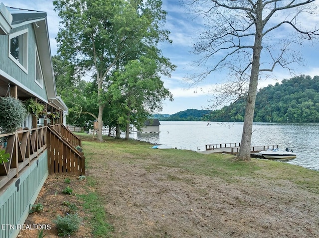 4225 W Lakeview Cir, Louisville, TN 37777 - view of yard with a water view, a boat dock, and a forest view