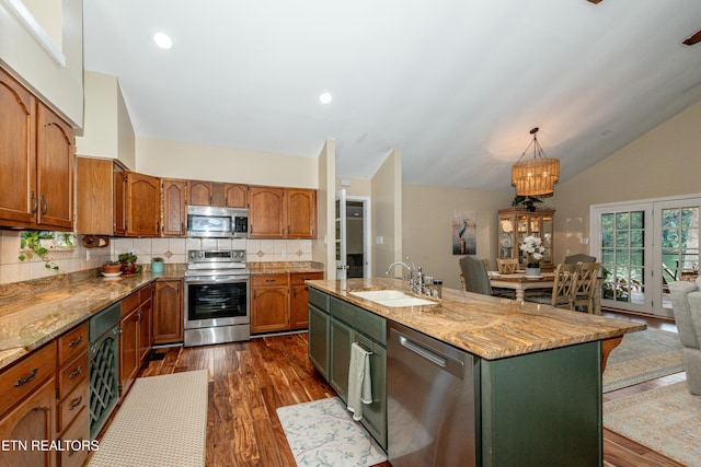 4225 W Lakeview Cir, Louisville, TN 37777 - kitchen with appliances with stainless steel finishes, a sink, dark wood finished floors, tasteful backsplash, and lofted ceiling