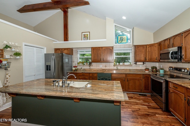 4225 W Lakeview Cir, Louisville, TN 37777 - kitchen with stainless steel appliances, high vaulted ceiling, a sink, brown cabinets, and backsplash