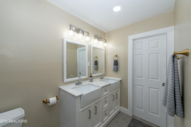 4225 W Lakeview Cir, Louisville, TN 37777 - full bath with tile patterned floors, double vanity, toilet, and baseboards